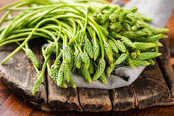 Wild asparagus on a wooden board