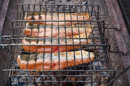 Salmon fillets in a grid on the grill