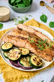 Grilled salmon with courgette and red onions