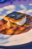 Sea bass with aubergine puree and olive sauce