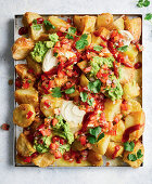 Crispy potato nachos with guacamole and salsa