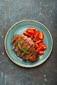 Roasted duck breast with tomato salad