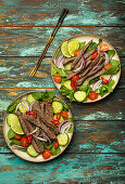 Thai beef salad with vegetables and mint