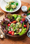 Wild garlic dumplings on a spring salad