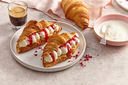 Filled croissants with mascarpone cream and raspberry sauce