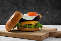 Burger with beef, cheese, black pudding and fried egg