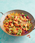 Vegetable wok with chicken, edamame and red chillies