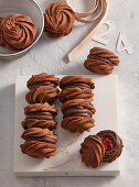 Cocoa sandwich cookies with sour cherry filling