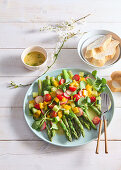 Green asparagus salad with tomatoes and radishes