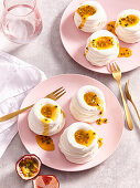 Mini pavlova with passion fruit sauce