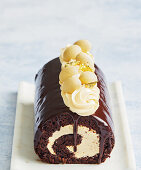 Chocolate sponge roll with caramel cream filling