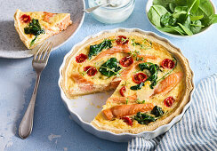 Salmon quiche with spinach and cherry tomatoes