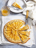 Shortcrust pastry pear galette with apricot jam