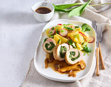 Pork roulade with spinach filling and potato salad