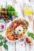 Tomato salad with burrata and redcurrants