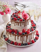 Dripping wedding cake with berries