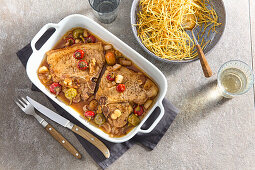 Pork chops with pickled peppers and potato straw