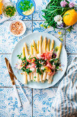 White asparagus with arugula vinaigrette and prosciutto