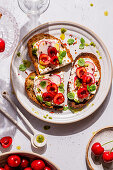 Bruschetta with cream cheese, cherries and radishes