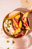 Melon with prosciutto and burrata