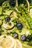 Salad with zucchini, asparagus, cucumber, peas and blueberries