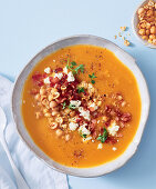 Creamy pumpkin soup with bacon and chickpea crunch