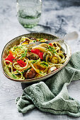 Mediterranean spaghetti with pesto and grilled vegetables