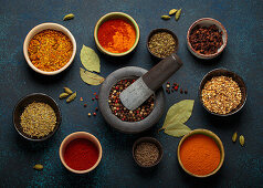 Various spices and herbs in bowls