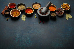 Various spices and herbs in bowls