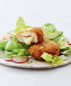 Stuffed chicken breast with salad and avocado