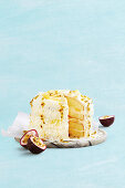 Lemon curd cake with passion fruit and coconut flakes