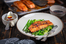 Baked salmon on steamed vegetables