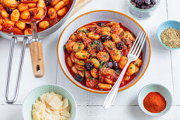 Gnocchi with tomato sauce, zucchini and olives