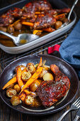 Roast chicken thighs with potatoes and carrots