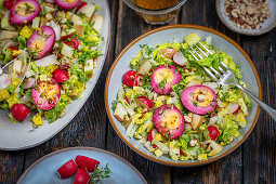 Colorful salad with apple, nuts and marinated eggs