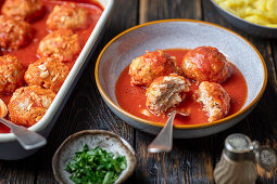 Chicken, rice and cabbage balls in tomato sauce