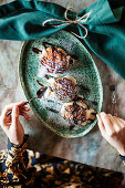 Profiteroles with chocolate sauce and icing sugar