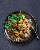 Pork and mushroom casserole with broccolini and pearl barley