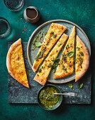 Pizza with roasted garlic, mascarpone and winter pesto