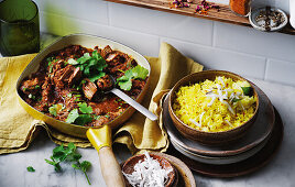 Yellow lemon rice with savoury lamb curry and grated coconut