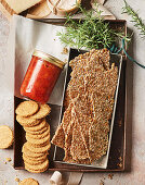 Peach chutney, crackers with seeds and oat biscuits