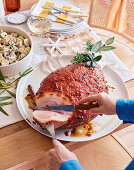 Seasoned sticky roast ham with peach glaze