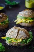 Rye roll with mango curry spread, salad and cucumber