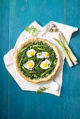 Green rustica with monk's beard, green asparagus and quail eggs