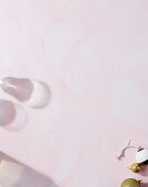 Light pink background with shades of glass