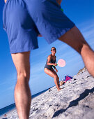 Couple playing beach ball, Sylt, North Sea, Germany