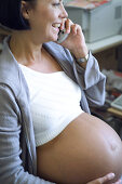 Pregnant women, on the phone People