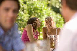 Young people having fun in beer garden, Munich, Bavaria