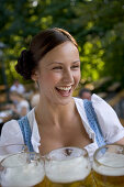 Waitress with beer glasses, Starnberger See Bavaria, Germany