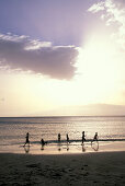 Children playing on the beach in the sunset, Mindelo, Sao Vicente, Cape Verde Islands, Africa